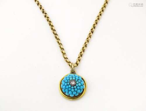 A Victorian yellow metal pendant and chain necklace, the pen...
