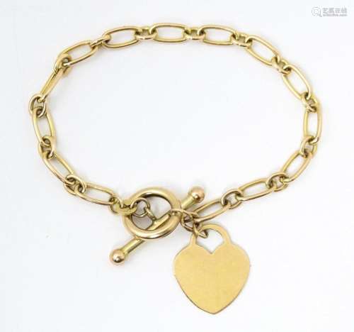 A 9ct gold and yellow metal bracelet.