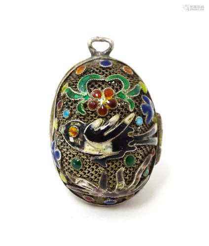 A gilt metal pendant / vinaigrette of egg form with enamel b...