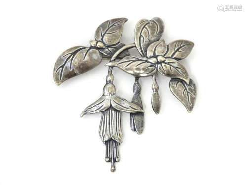 A silver brooch with fuchsia detail. Hallmarked Birmingham 1...