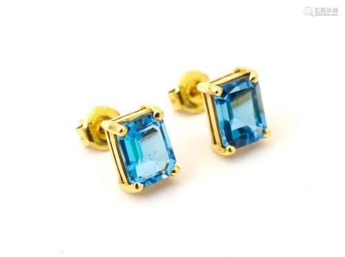 A pair of 18ct gold stud earrings set with topaz. Approx 1/4...