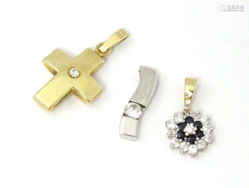 Three various 9ct gold pendants to include a white gold exam...