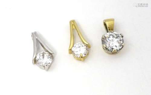 Three 9ct gold pendants set with cubic zirconia. To include ...