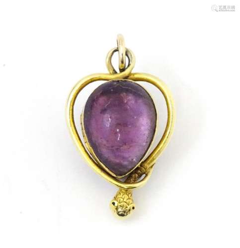 A Victorian pendant of locket form with central amethyst cab...