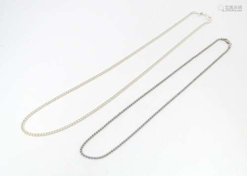 Two silver chain necklaces. The longest 24" (2)