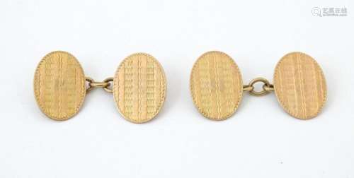 A pair of 9ct gold cufflinks with engine turned decoration