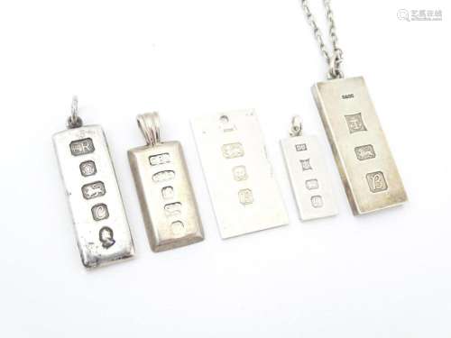 Five various silver ingot formed pendants, one on a silver c...