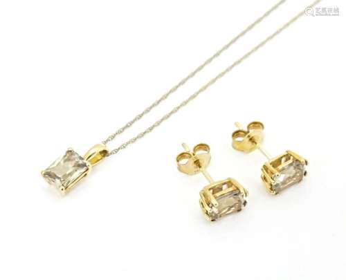 A 9ct gold pendant set with csarite, together with a pair of...