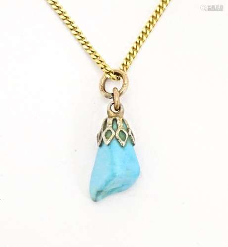 A 9ct gold necklace with turquoise drop pendant. Chain appro...