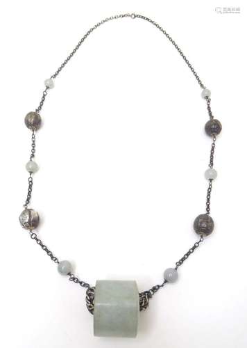 A silver and white metal necklace set with white metal and j...