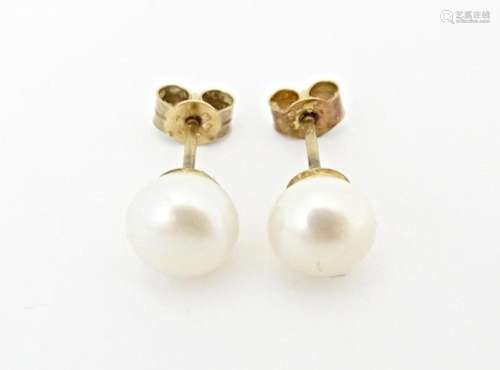 A pair of pearl stud earrings