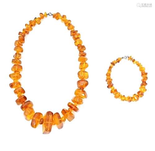 A vintage necklace of graduated amber coloured beads. Approx...