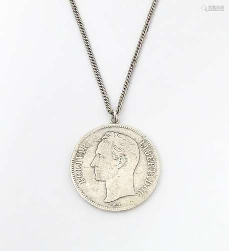 A white metal longuard / watch chain with pendant formed fro...