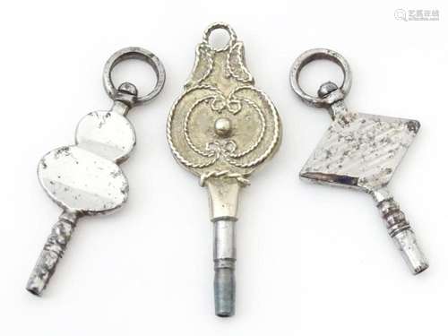 Three assorted pocket watch keys to include cut steel exampl...