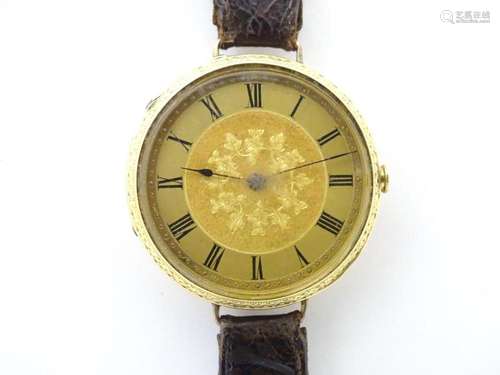 An 18ct gold pocket watch converted into a wristwatch, with ...