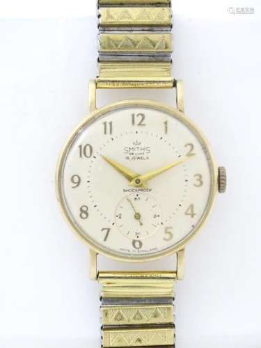A 9ct gold cased Smiths wristwatch, the dial signed ' Sm...