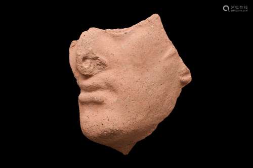 ETRUSCAN TERRACOTTA ACROTERION FRAGMENT OF THE FACE OF HERCL...