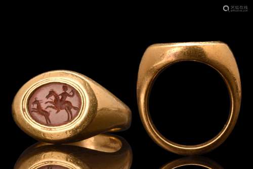 RARE ROMAN GOLD RING WITH CARNELIAN INTAGLIO DEPICTING A HUN...