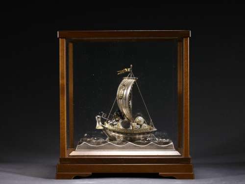 A gold and silver Smooth Sailing ornament