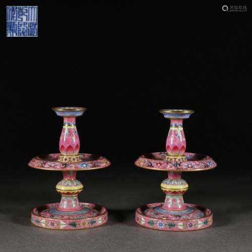 A Pair of Famille Rose candle holders with twining lotus flo...
