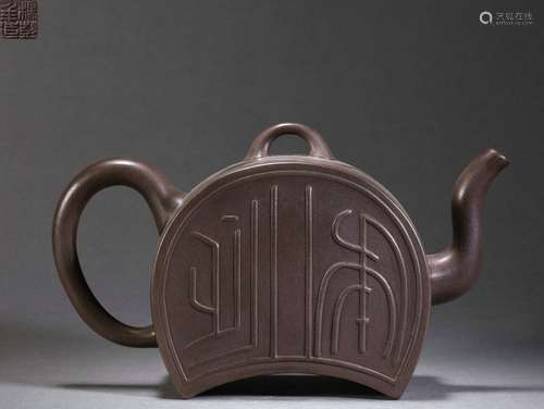 A Crescent shaped Purple Clay Teapot