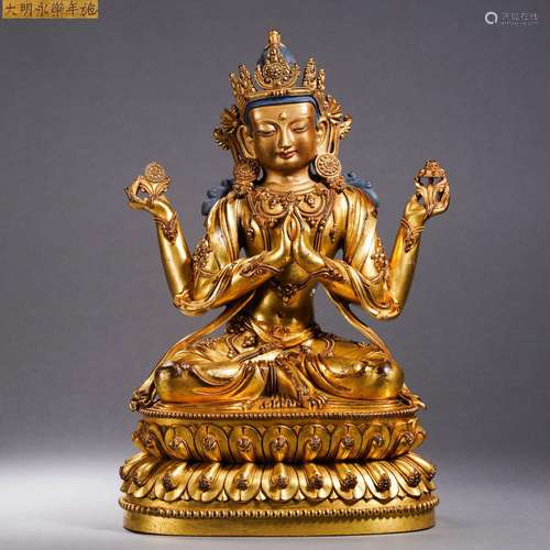 A Gilt bronze four-armed Guanyin