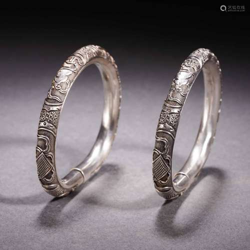 A pair of silver bracelets