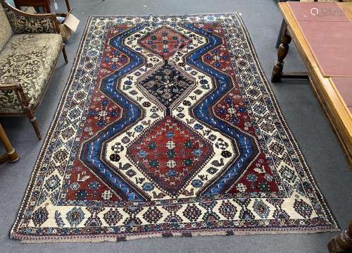 A Caucasian red ground carpet, 335 x 214cm