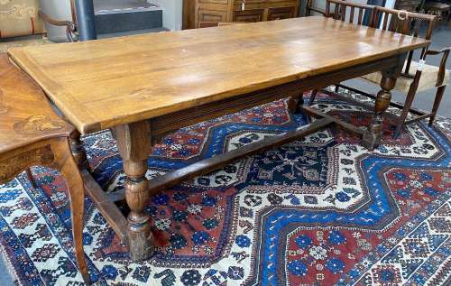 An 18th century style rectangular oak refectory dining table...