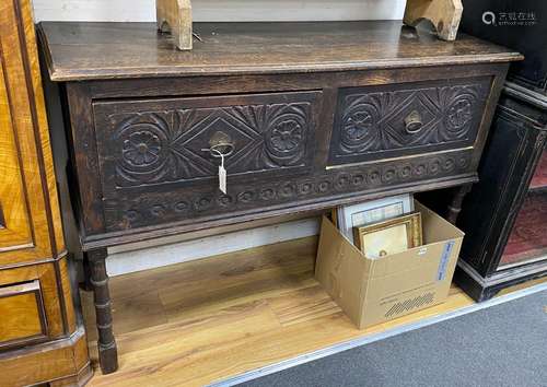 An early 20th century Jacobean revival oak low dresser, widt...