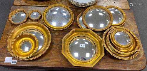 Twelve assorted modern convex wall mirrors, largest width 26...