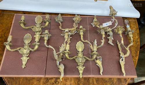 Eight assorted cast brass twin branch wall lights, largest h...