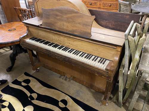 An early 20th century walnut cased upright grand piano by Mo...