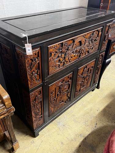 A Chinese carved hinged top cocktail cabinet with mirrored i...