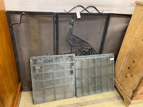 A set of six copper framed glass panels and a folding wrough...