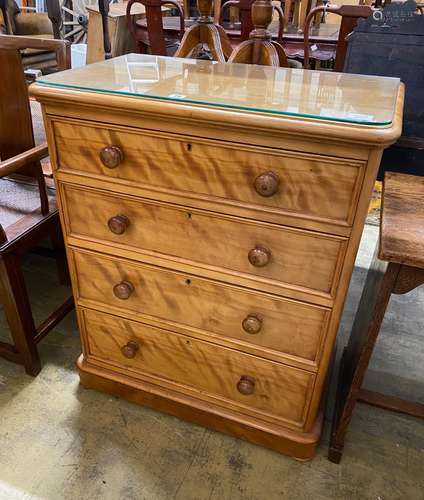 A small Victorian satin birch chest of four graduating drawe...