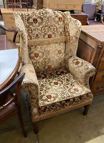 A George III style upholstered wing armchair, width 86cm, de...