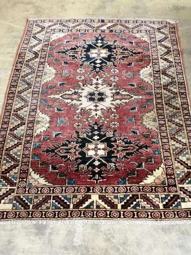 A Nazak red ground rug, 152 x 127cm