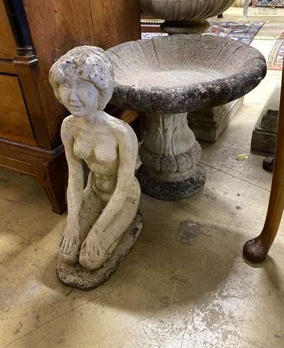 A circular reconstituted stone bird bath, diameter 48cm, hei...