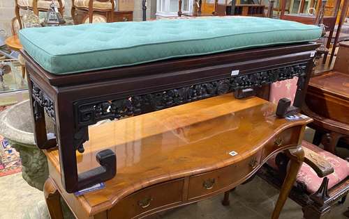 A Chinese hardwood bench, with carved and pierced frieze and...