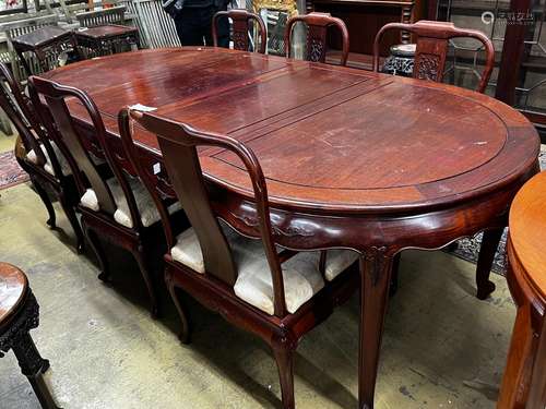 A Chinese hardwood extending dining table, length 244cm exte...