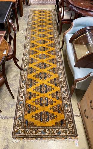 An Afghan gold ground geometric runner, 400 x 85cm