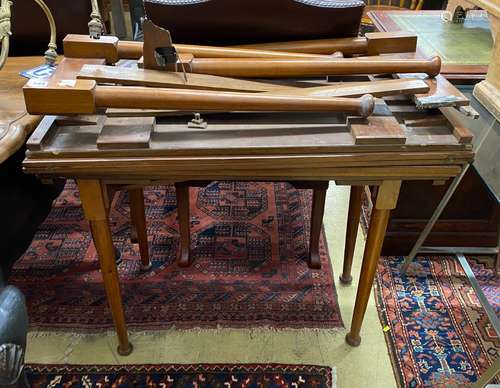 A pair of Edwardian mahogany campaign card tables, one requi...