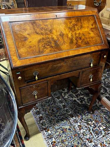 An early 20th century Queen Anne revival walnut bureau, widt...