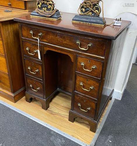 A George III style mahogany kneehole desk, width 73cm, depth...