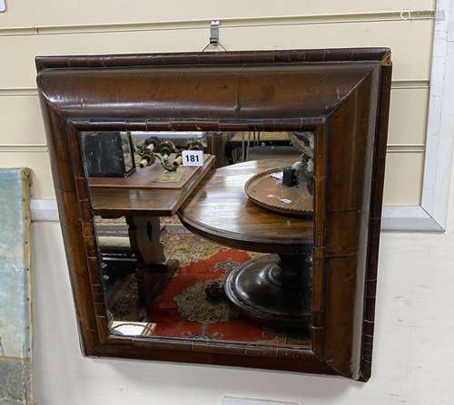 A William and Mary walnut veneered cushion framed wall mirro...