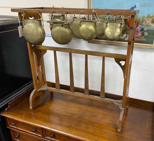 An Arts & Crafts oak and brass Glockenspiel by Plant and...