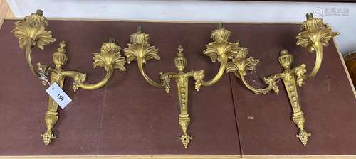 A set of three French rococo cast brass twin branch wall lig...