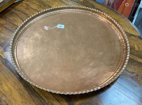 A large circular copper tray, diameter 74cm