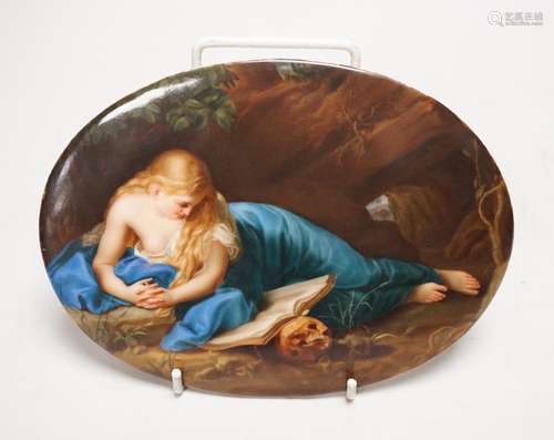 A 19th century painted porcelain oval plaque of a reclining ...